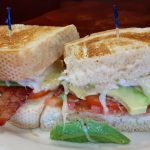 7) Breakfast Sandwich – Two eggs, bacon or ham, tomatoes and cheese